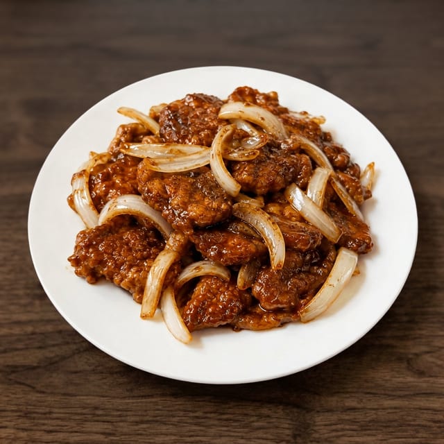 Pork Chop with Onion in Black Pepper Sauce.